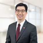 A professional headshot of Collins Chin, the new Bank of Singapore global CFO, wearing a dark suit and maroon tie